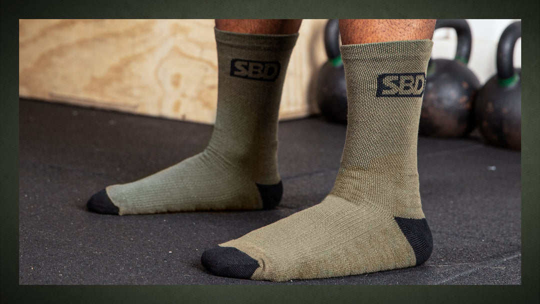 SBD Sport Sokken Endure Groen – groene sportsokken met donkere tenen en hielen, gedragen