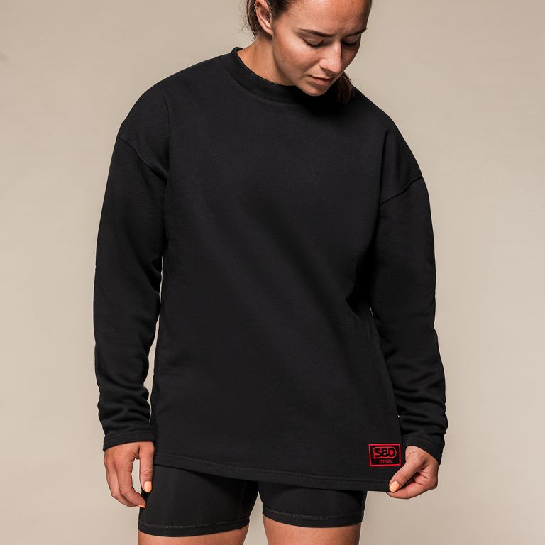 SBD Sweatshirt Classic – detail van de pasvorm en het rode label bij de zoom