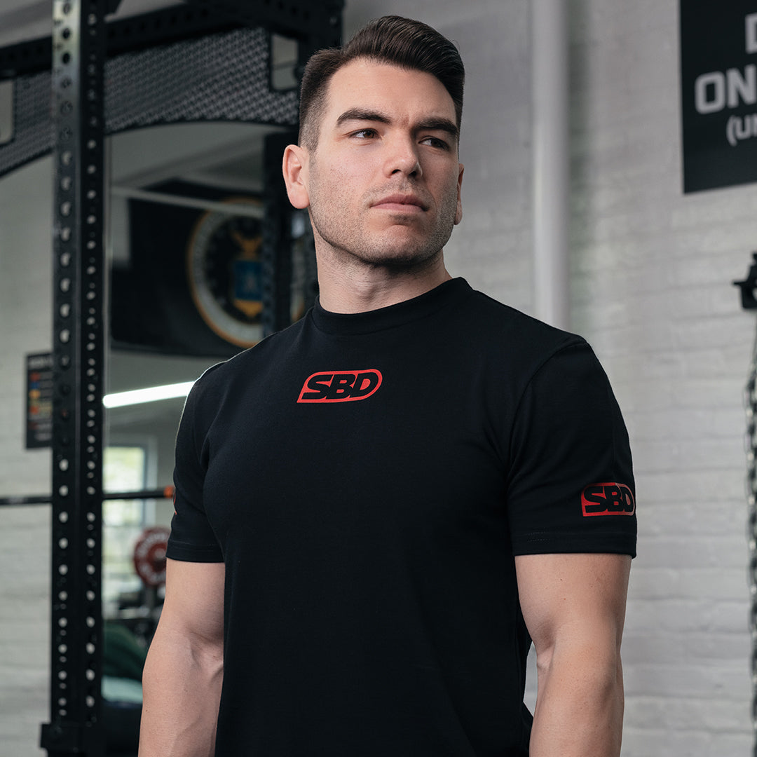 SBD Competition Shirt – zwart herenmodel met rode logo&
